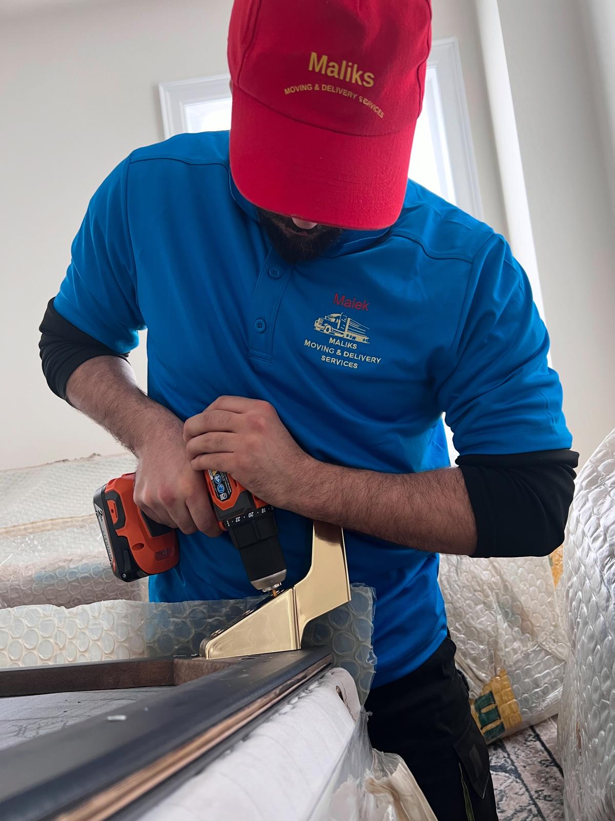 The Founder Malek, installs furniture 